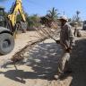 Servicios Públicos Retira Servicios Públicos ramas y cacharros de vía pública